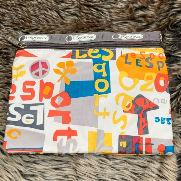 Lesportsac Handbags - LeSportSac zipper pouch
Repeated logo and peace sign!